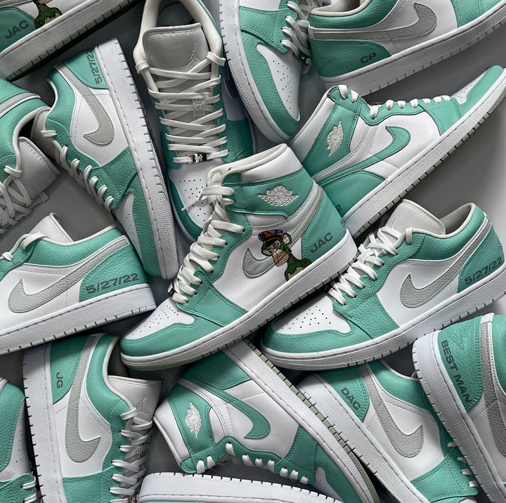 Custom Jordan 1 Highs and Jordan 1 Lows in a mint green colourway to match the bridesmaids dresses for the groomsmen to wear on the wedding day. Each pair also had initials and the wedding date added to them.