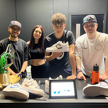  MattB Customs artists and Wolfiez holding custom air force 1 trainers at Insomnia Gaming Festival