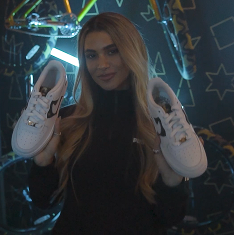 Joanna Chimonides with custom Air Force 1 trainers at JD street party activation