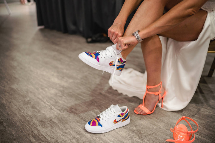 Bride wearing custom jordan 1 lows to match her dress and colour scheme at wedding.