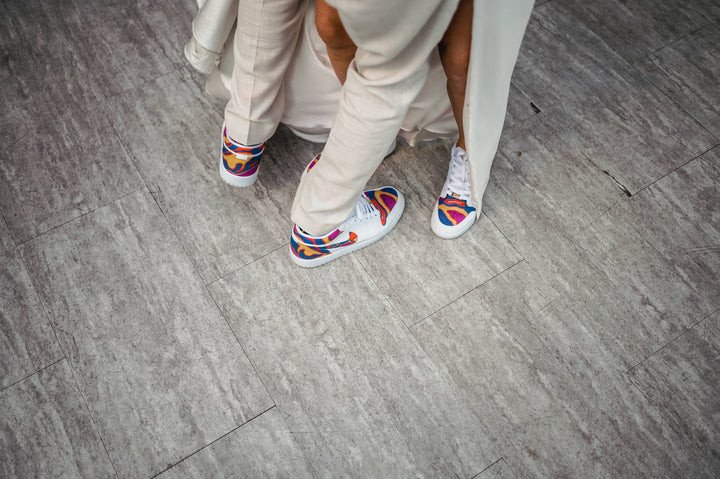bride and groom dancing at their wedding with their matching custom jordan 1 low trainers
