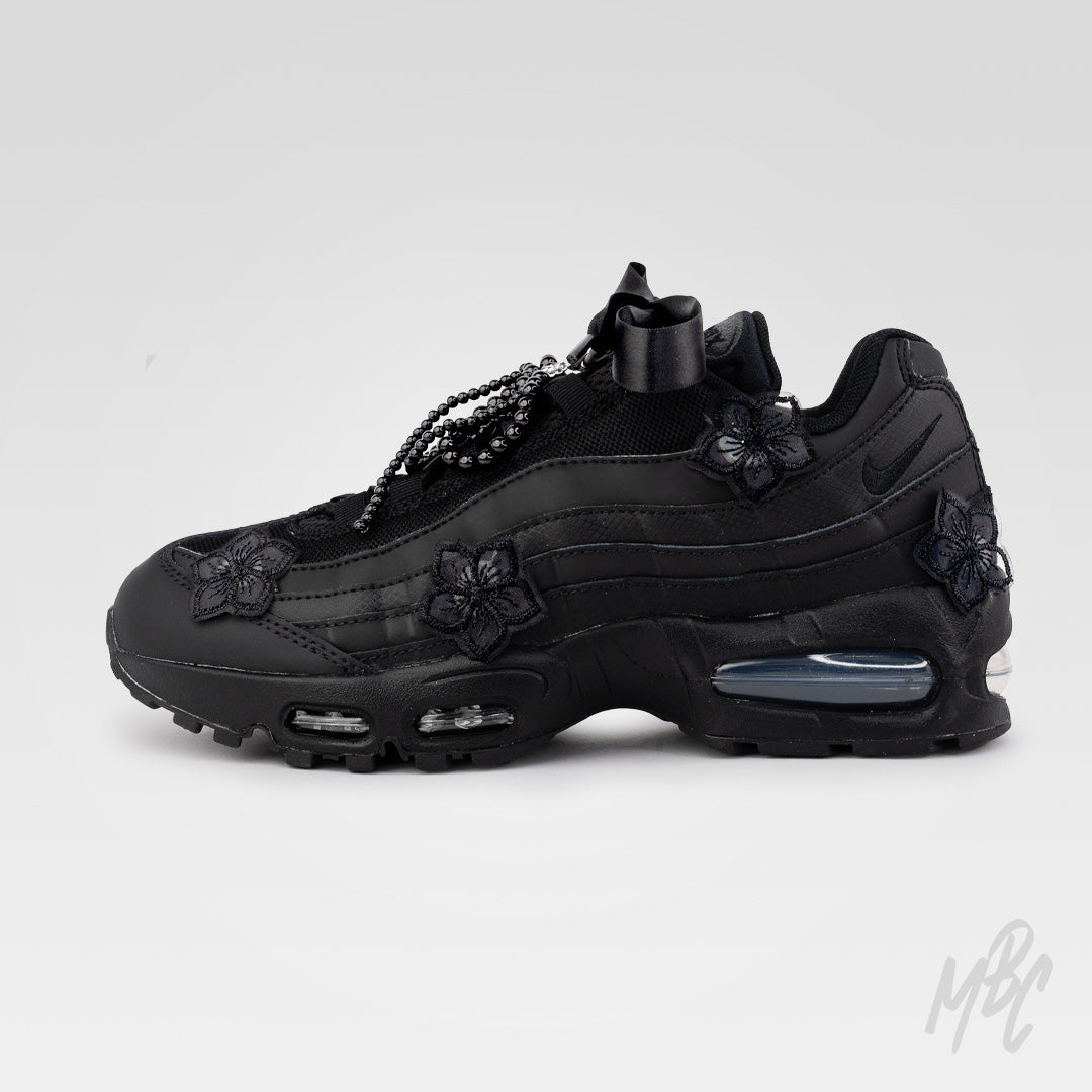 Side profile of Midnight Veil custom Nike Air Max 95 with monochrome black design, satin ribbon laces and removable lace charms.