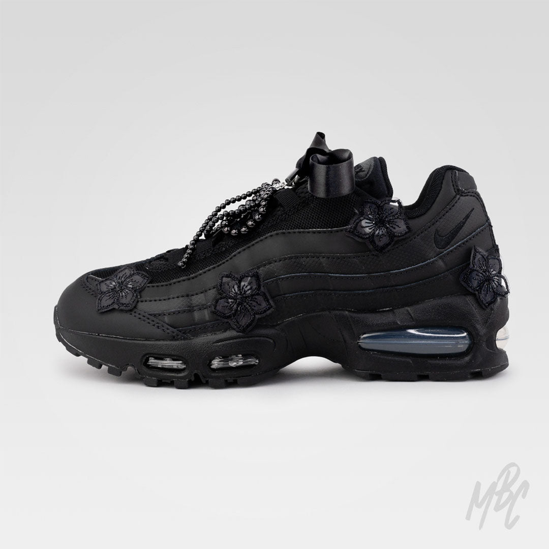 Side profile of Midnight Veil custom Nike Air Max 95 with monochrome black design, satin ribbon laces and removable lace charms.