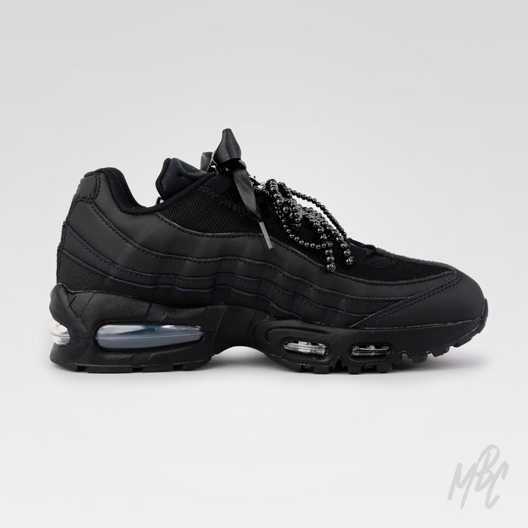 Inner side view of Midnight Veil custom Nike Air Max 95 featuring black floral appliqué, satin ribbon laces and black beaded bow lace charms.