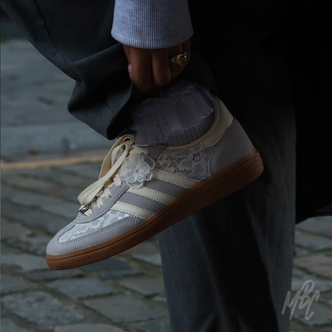 Close-up of Lacey Flower custom Adidas Spezial trainers with floral lace detailing and gum sole on foot
