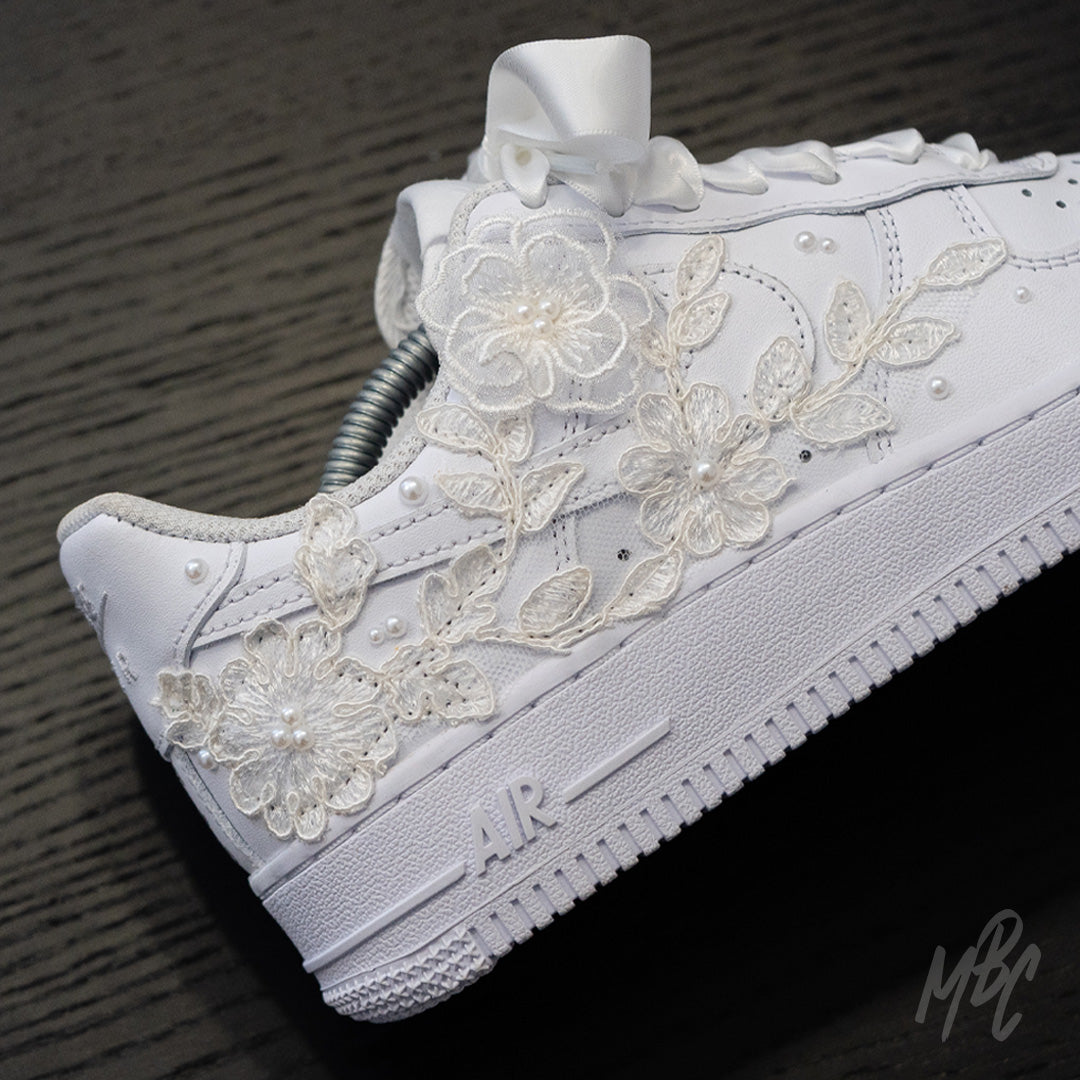 White Nike Air Force 1 custom with lace floral appliqué, pearl detailing and satin ribbon laces