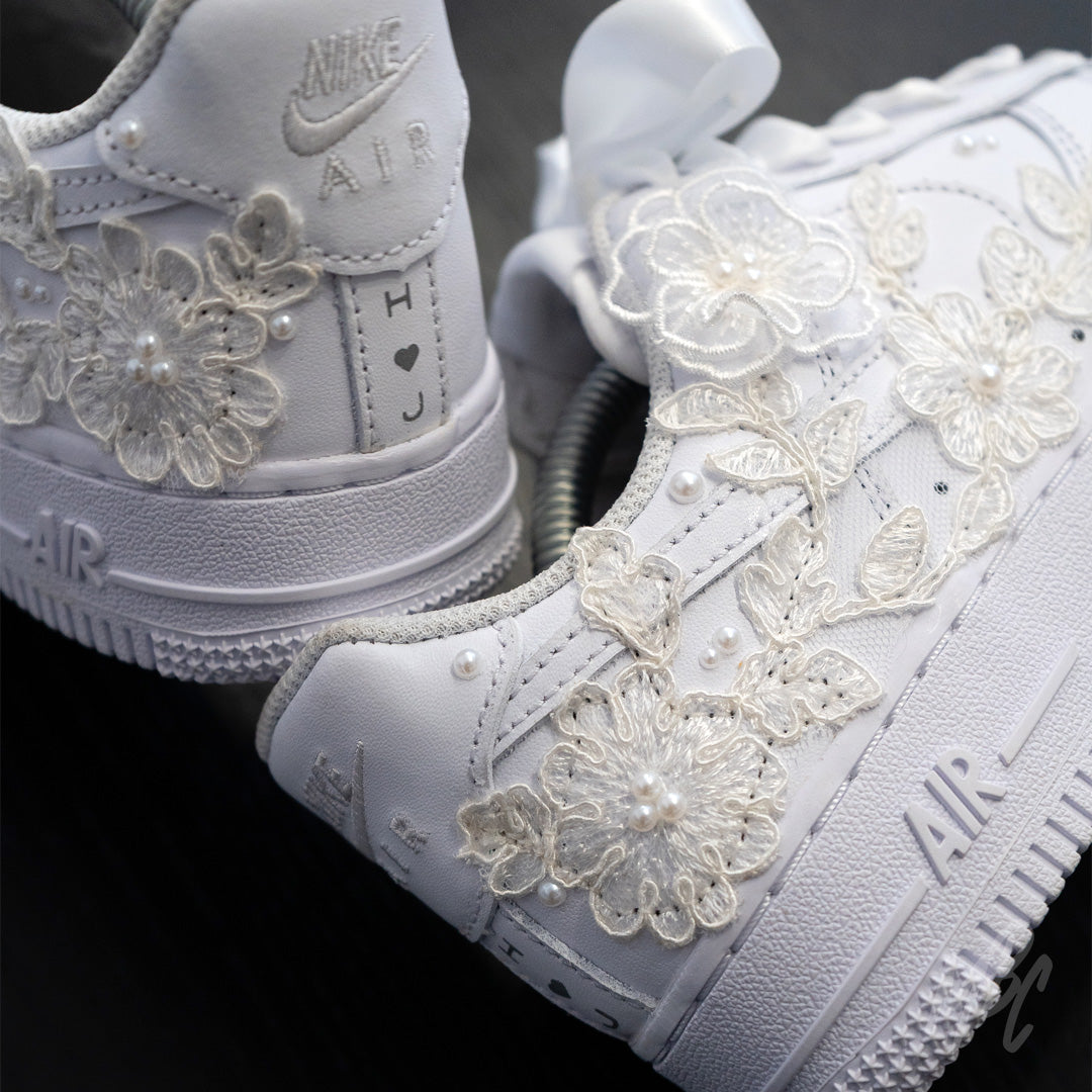 Rear and side view of white Air Force 1 custom featuring lace floral overlays and pearl accents