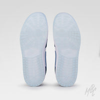 Navy Suede Jordan 1 Low Golf outsole view showing translucent blue golf traction sole for grip and stability on the course