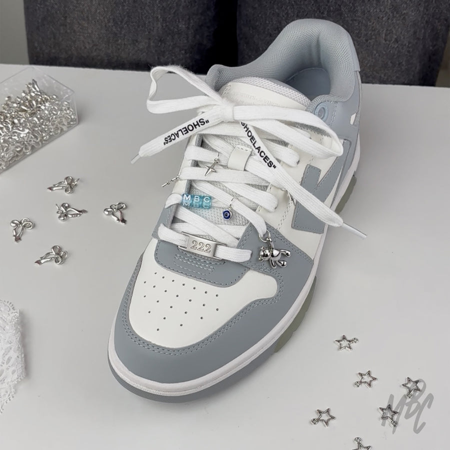 Off-White sneaker with lace charms and custom engraved lace lock