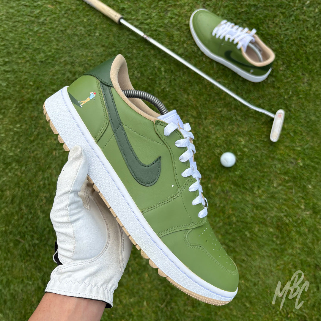Nike Air Jordan 1 Low Golf Off The Tee custom golf sneakers in green, held on course with golf club and ball