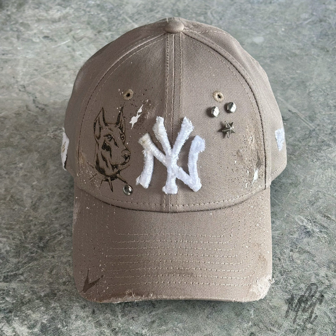Beige custom New Era NY cap K9 design with frayed NY logo, star studs and hand detailed Doberman illustration