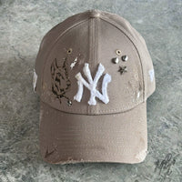Beige custom New Era NY cap K9 design with frayed NY logo, star studs and hand detailed Doberman illustration