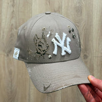 Custom New Era NY K9 cap with Doberman illustration, distressed finish, paint splatters and stud detailing