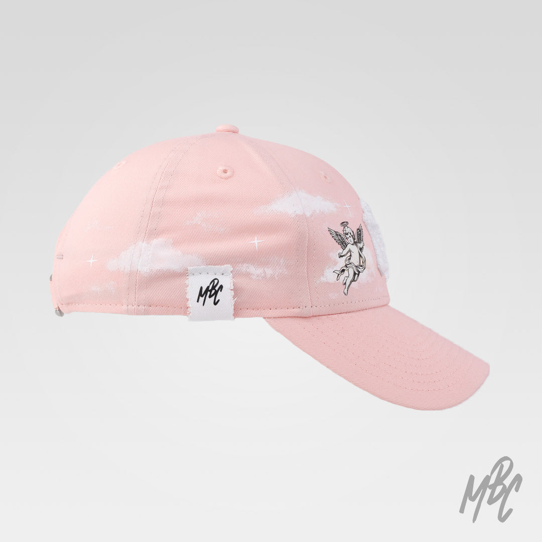Pink New Era NY custom cap with angel artwork, cloud detailing and side profile view