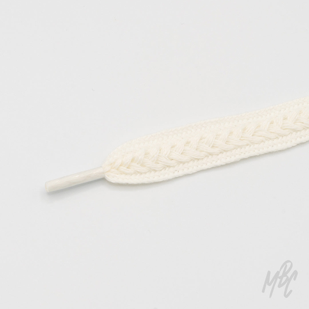 White woven sneaker laces with braided pattern and textured detailing for custom trainers and premium footwear