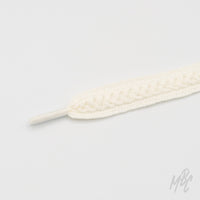 White woven sneaker laces with braided pattern and textured detailing for custom trainers and premium footwear