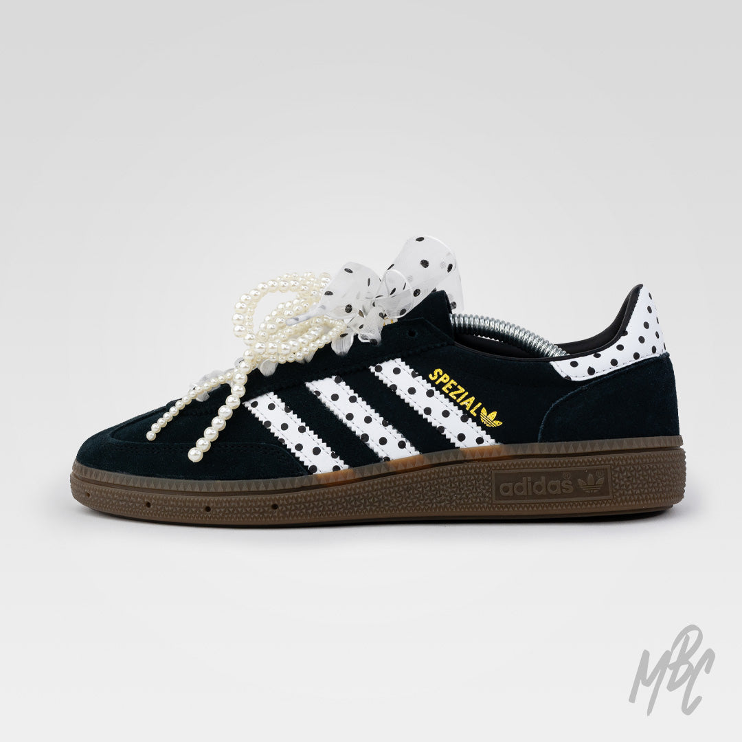 Custom Adidas Spezial black suede sneaker with polka dot stripes, pearl lace detailing and ribbon bow
