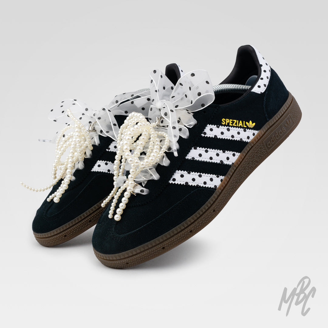Pair of custom Adidas Spezial trainers with polka dot design, pearl lace accessories and ribbon bows