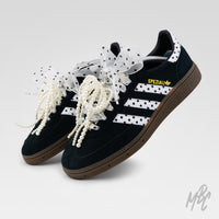 Pair of custom Adidas Spezial trainers with polka dot design, pearl lace accessories and ribbon bows