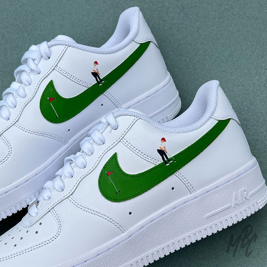 White Nike Air Force 1 with hand painted golf design with golfer putting on the swoosh