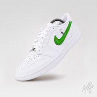 Custom Jordan golf shoes Putting Swoosh 2.0 Air Jordan 1 Low Golf with green swoosh and hand painted golfer illustration