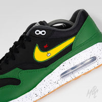 Close-up of Putting Greens Air Max 1 custom golf shoe with golf flag Swoosh graphic and speckled Air Max midsole