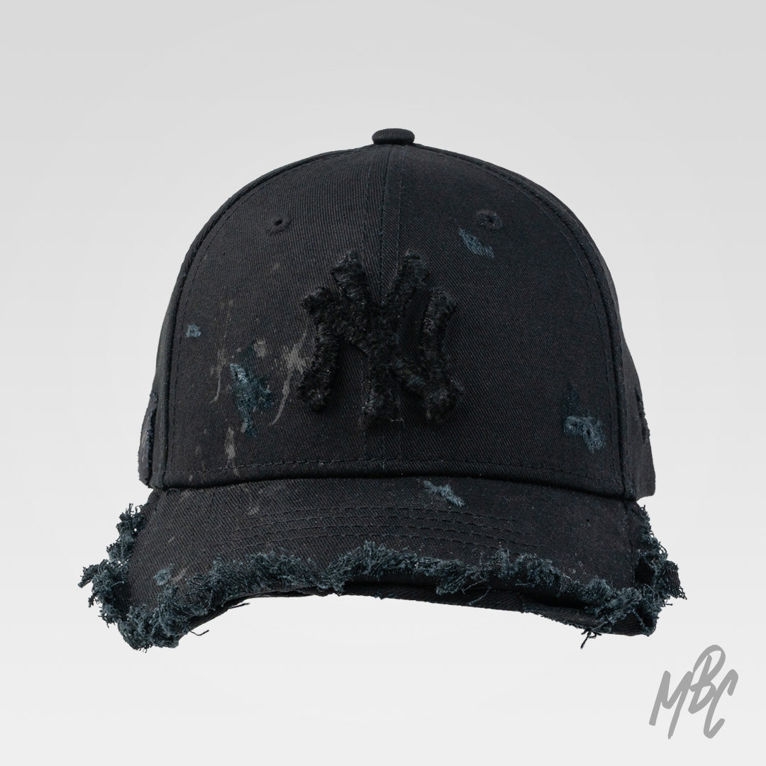 Raw Edge custom New Era NY cap in black with distressed finish, frayed brim and tonal NY logo