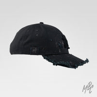 Black Raw Edge New Era NY custom cap with paint splatter, frayed details and side profile view