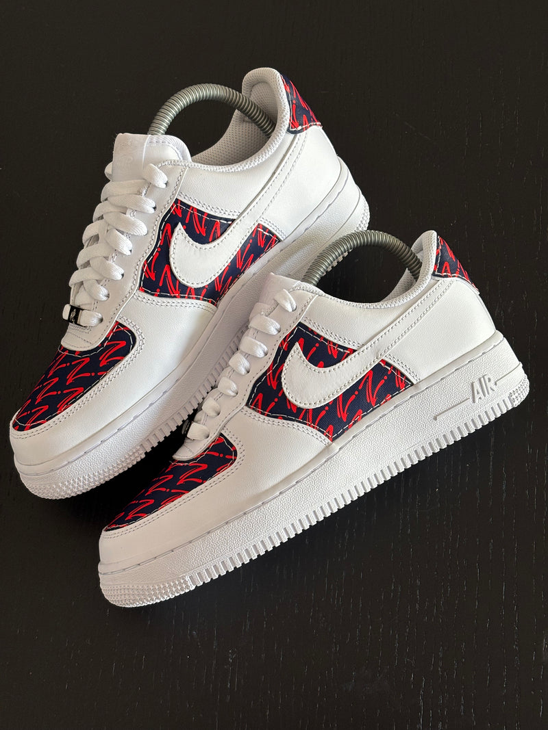 Custom Nike Air Force 1 with red graphic pattern panels showcasing personalised cut and sew sneaker customisation
