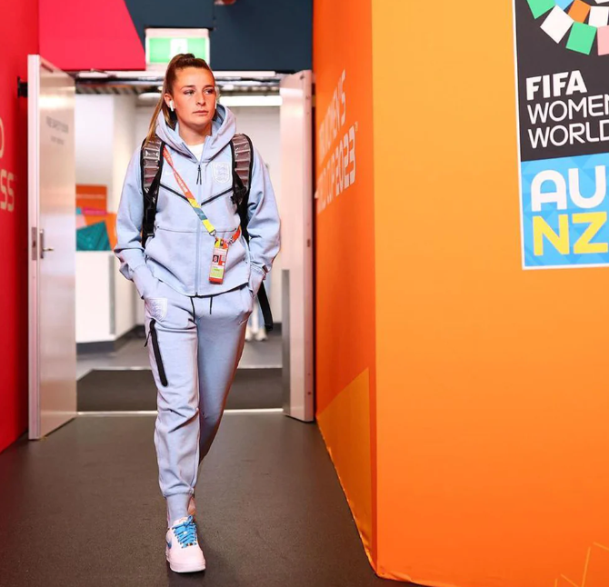 Lioness wearing custom Nike Air Force 1 trainers