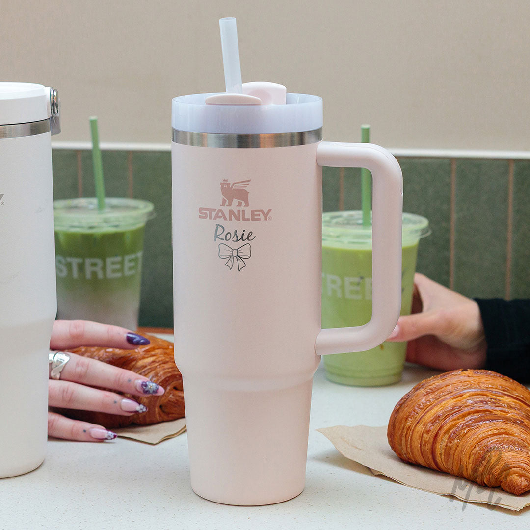 Stanley cup with personalisation on a table with matcha and croissants.