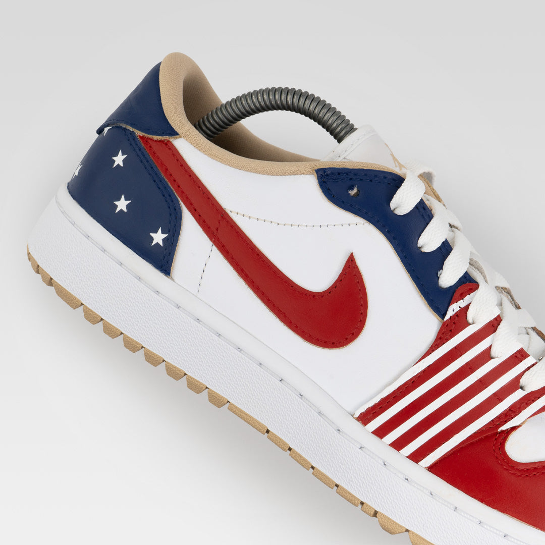 Stateside Drive Jordan 1 Low Golf custom sneaker with red Nike Swoosh, white leather upper and blue heel featuring white stars
