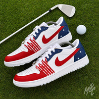 Stateside Drive custom Jordan 1 Low Golf shoes featuring hand-painted USA-inspired red, white and blue on a golf course with a golf club and ball.