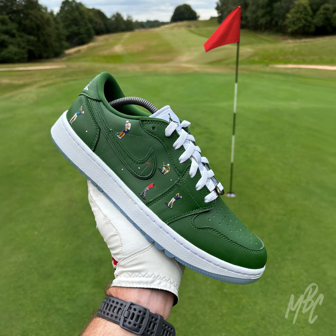 Sunday Club custom Jordan 1 Low Golf shoes photographed on a golf course, featuring hand-painted green leather, heat-pressed golfer illustrations and golf-inspired detailing.