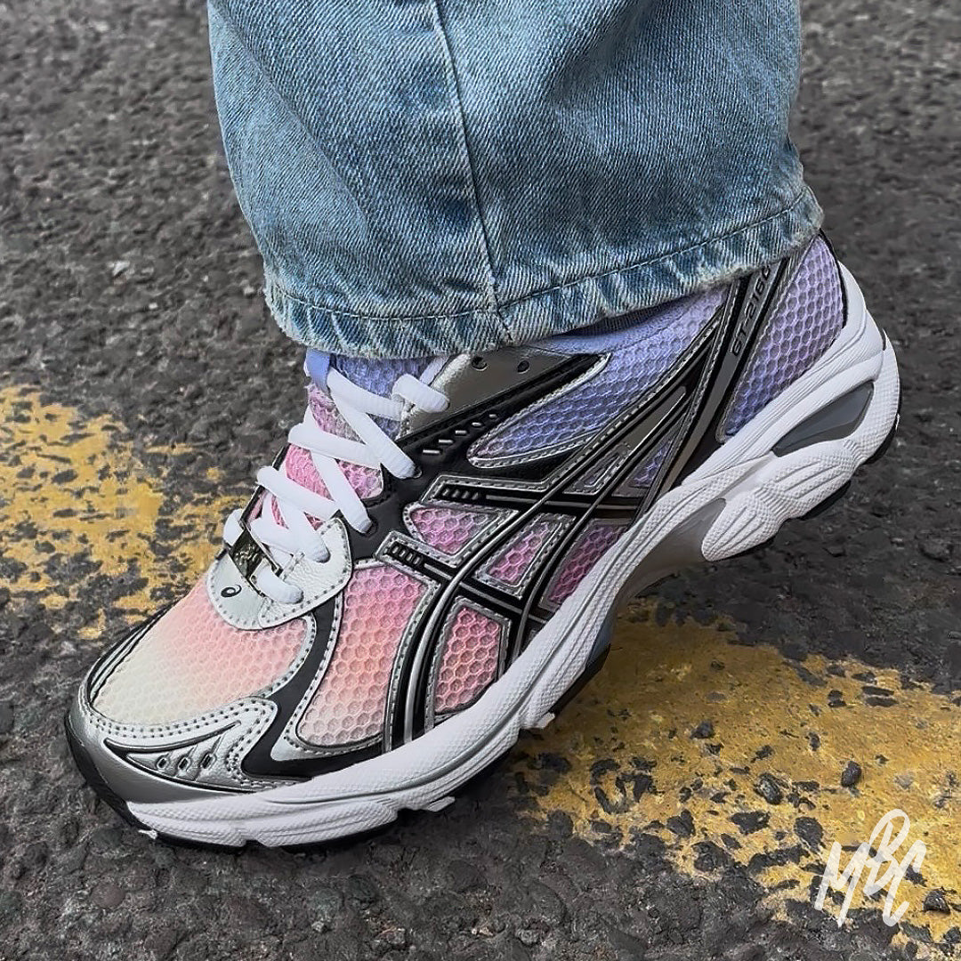 On-foot custom Asics GT-2160 Sunset Dip Dye sneaker with pink and purple sunset gradient finish