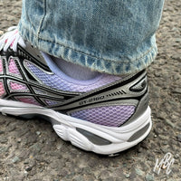 On-foot custom Asics GT-2160 Sunset Dip Dye sneaker with pastel purple gradient heel detail