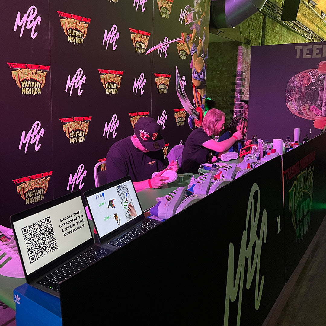 creating custom adidas superstar TMNT sneakers at film event in London, UK