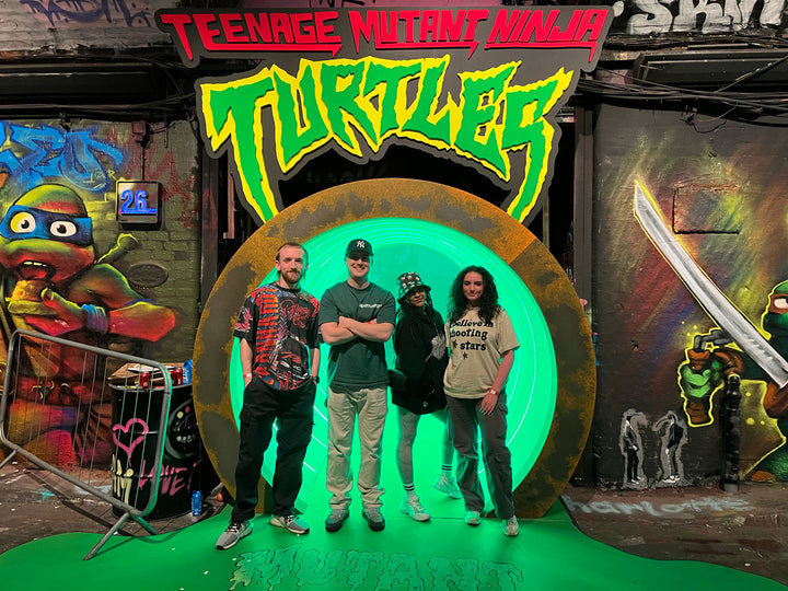 4 team members stood outside Teenage Mutant Ninja Turtles Lair event space in London, UK 