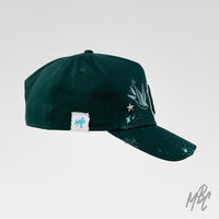 Green Twin Swallow New Era NY custom cap with bird illustrations, distressed finish, paint splatter and side profile view