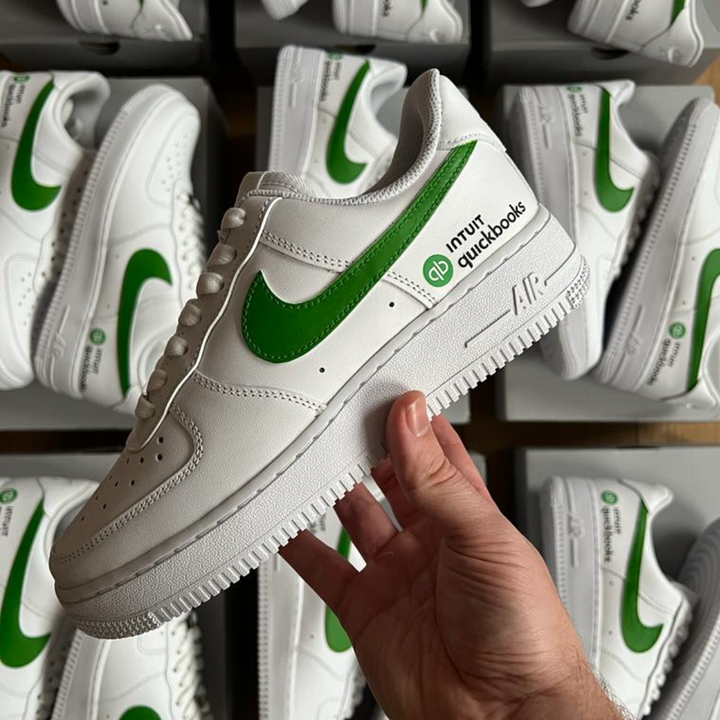 Bulk order of white Nike Air Force 1 customs trainers with Intuit Quickbooks branding
