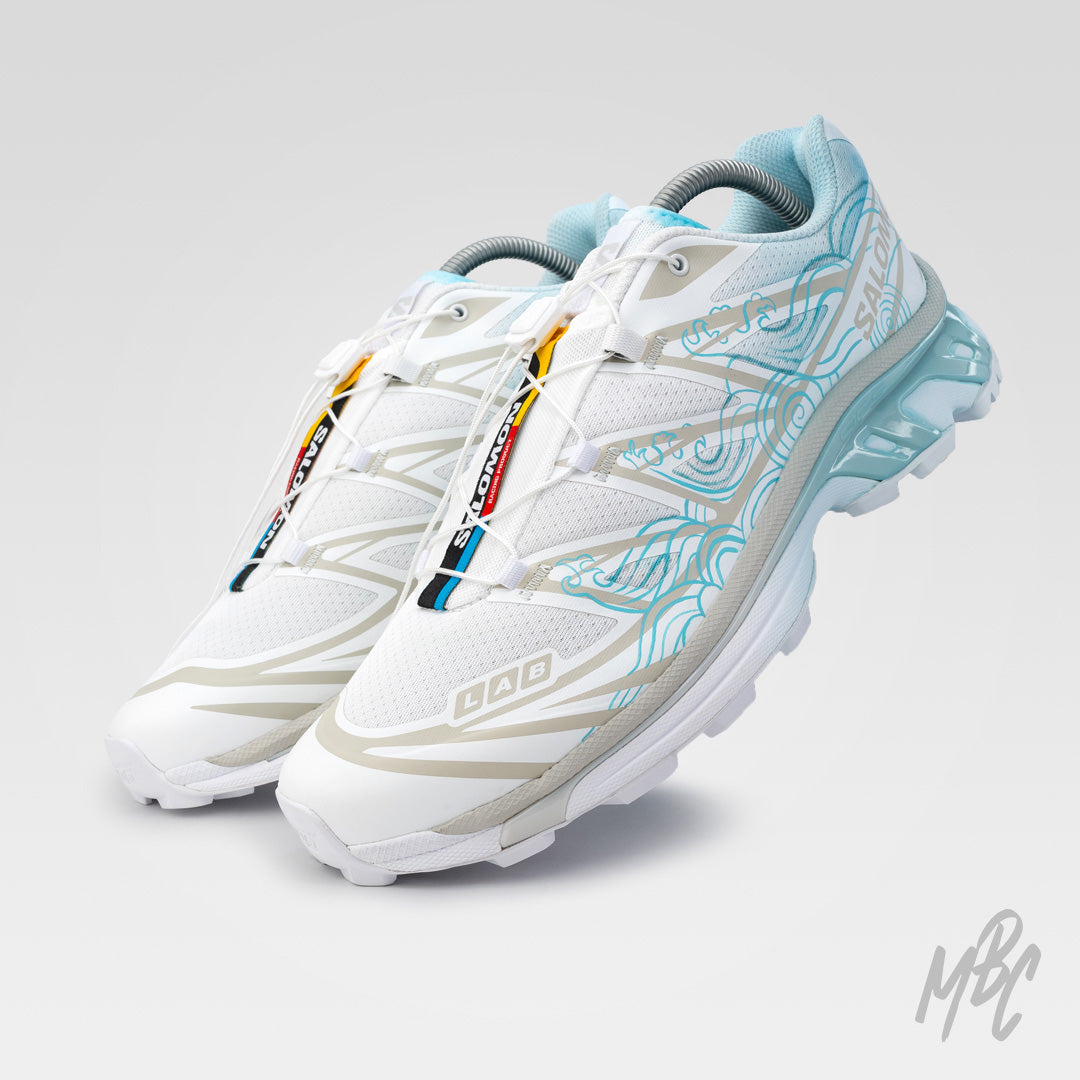 White Salomon XT-6 Waveform custom with blue dip dyed heel and wave artwork