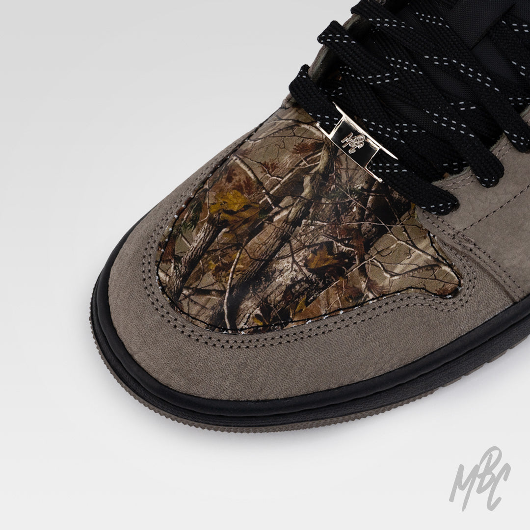 Woodland Camo Jordan 1 Low custom with brown suede overlays and woodland camo toe box detail