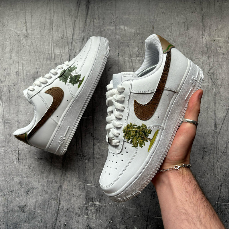 Custom Nike Air Force 1 featuring woodland artwork and textured woodgrain Swoosh details
