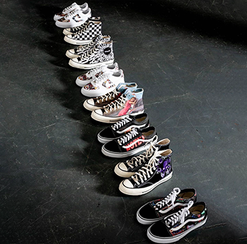 row of custom vans and converse created for off the rails magazine team members