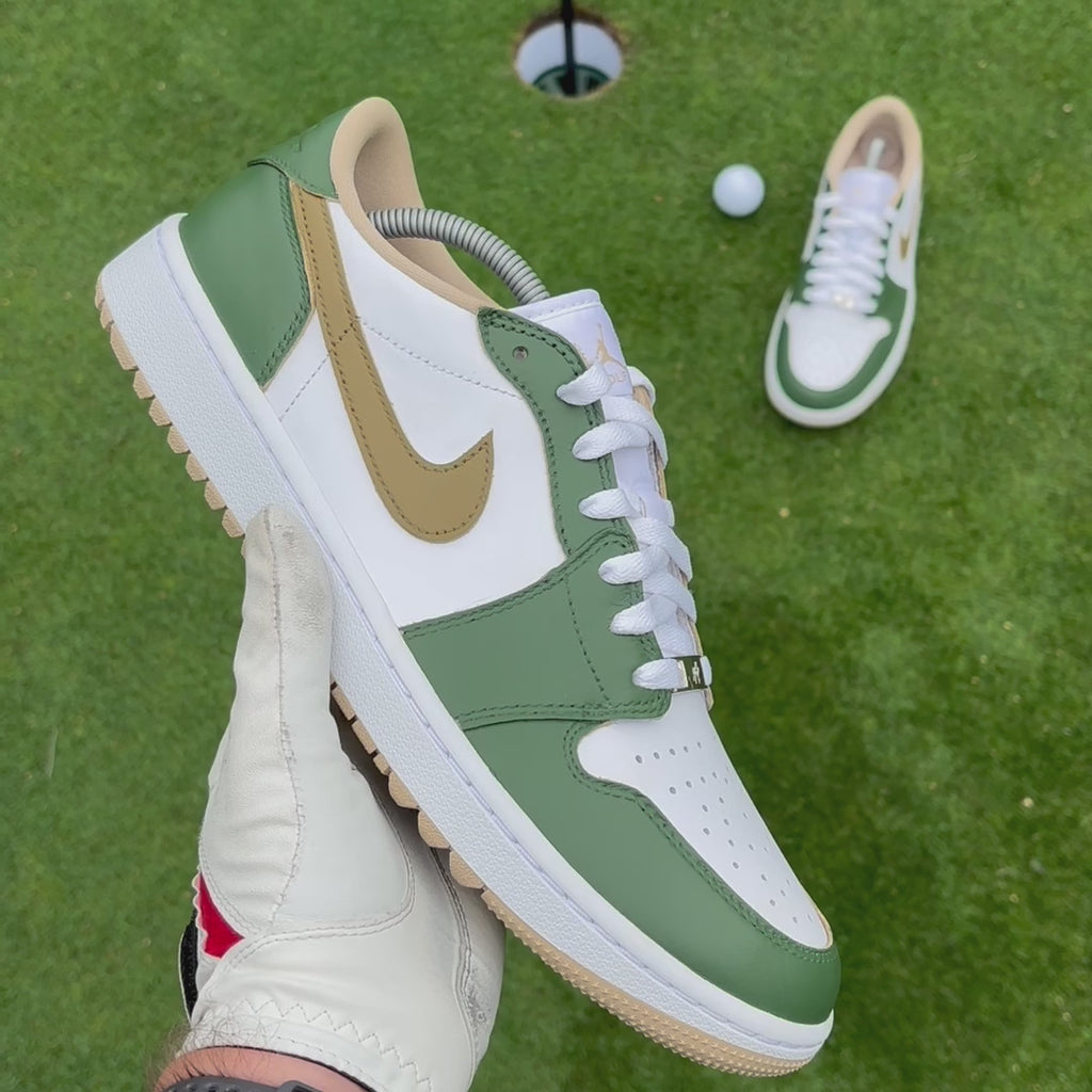 Fairway Gold custom Jordan 1 Low Golf shoes with hand-painted green and gold leather panels showcased on a golf course.