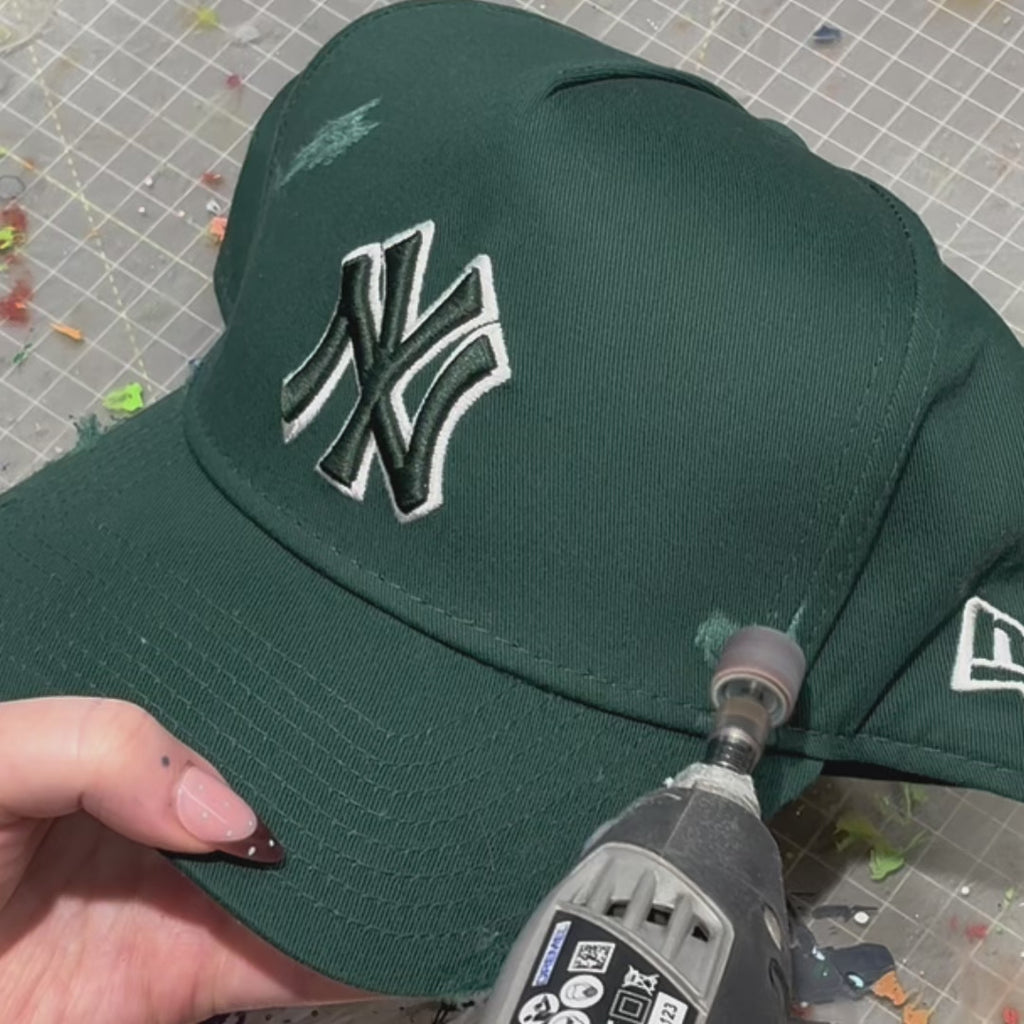Handcrafted Twin Swallow custom New Era cap with embroidered bird design and studio customisation process