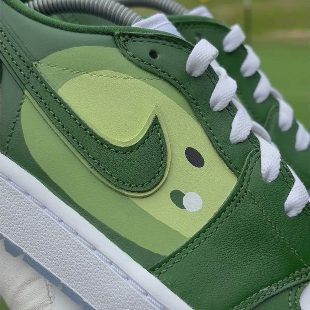 Pin Position custom Jordan 1 Low Golf shoes with hand-painted putting green artwork showcased on a golf course.