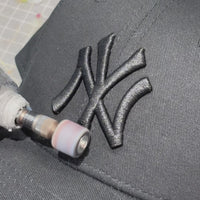 Video of hand customised New Era cap UK featuring raw edge distressing, frayed brim detailing and custom finish