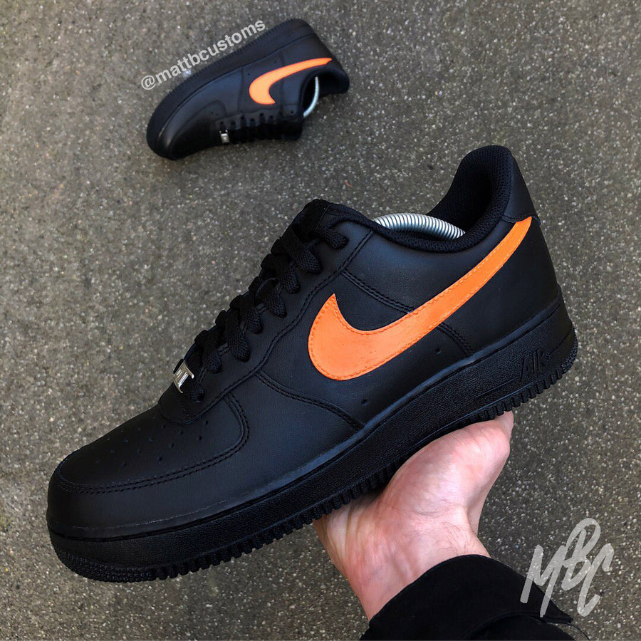 Black Nike Air Force 1 with Hand Painted Swoosh / Tick in a Colour of Your Choice. Available Colours are; Tangerine, Light Blue, Khaki, Stone Pink and more!